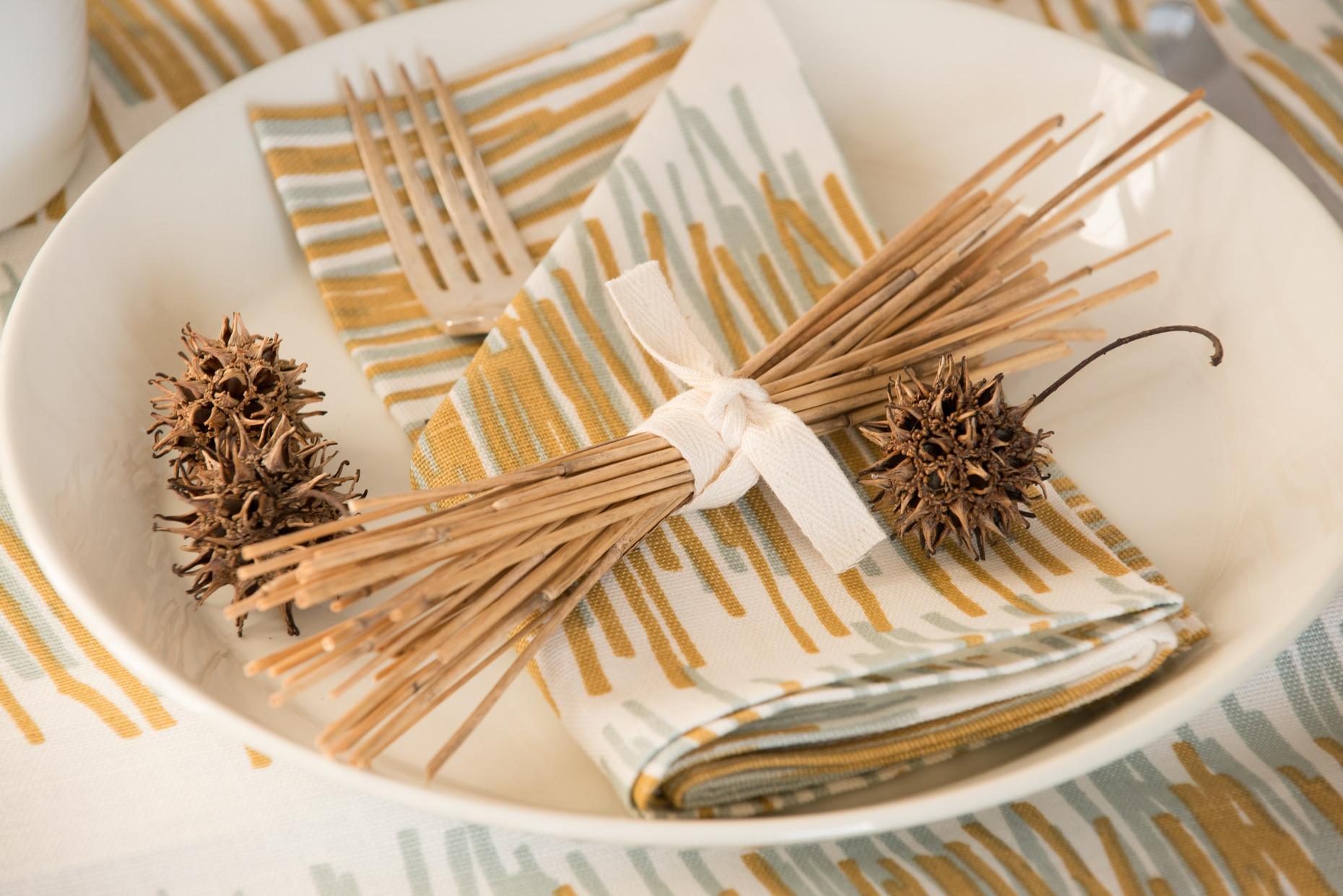 Product Photograph Bowl with linens and pinecones 